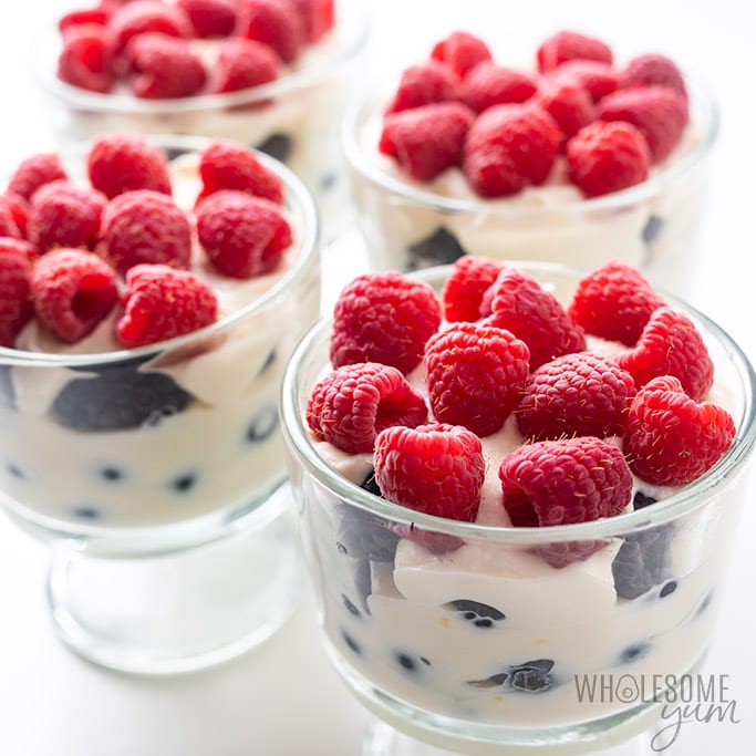 four small glasses with low carb ricotta cheese and berries dessert