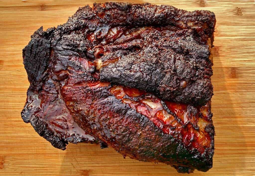 Low and slow is the key to the perfect smoked beef brisket with its crispy “crust” and pink smoke rings. Learn how to smoke brisket on a charcoal stove!