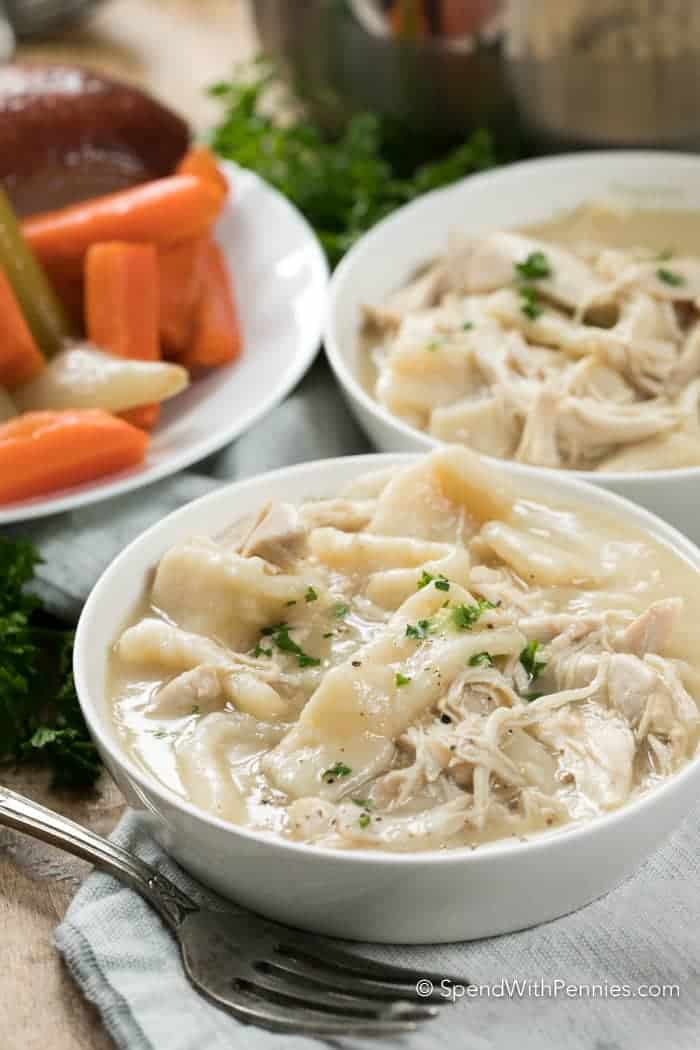 Two bowls of chicken and white dumplings