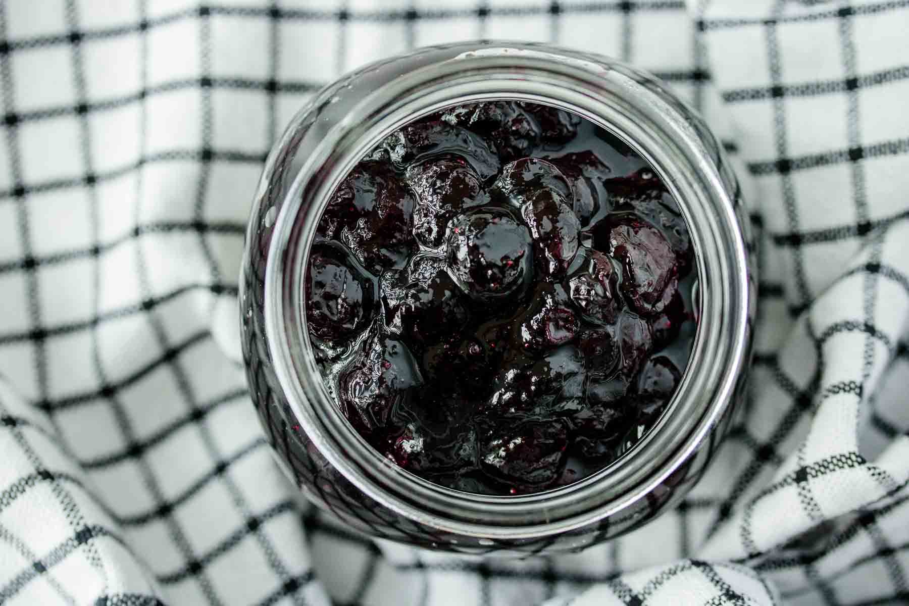 close up of blueberries in a spoon