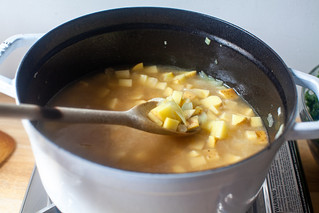 add potatoes and simmer until soft