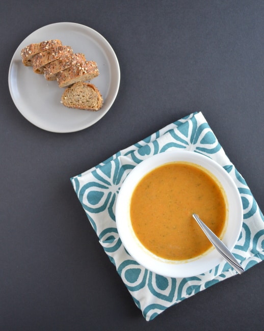 Sweet potato and carrot soup in a white bowl