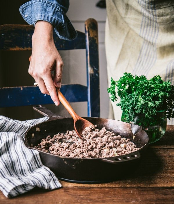Stir-fry ground beef in a cast iron pan