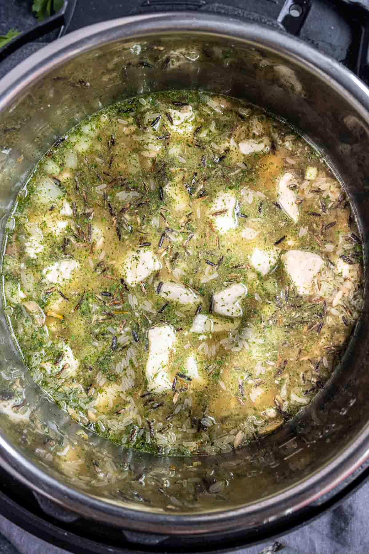 Chicken and mushroom ice cream and instant wild rice in two black bowls