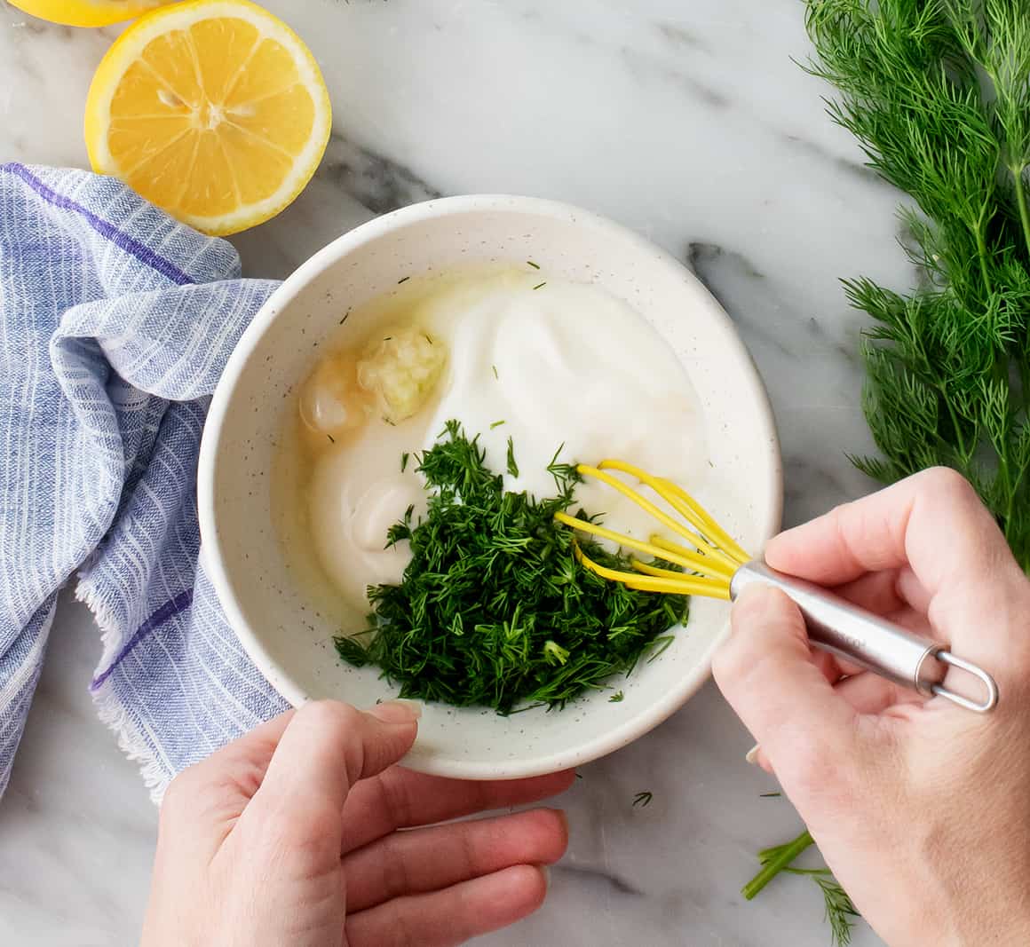 Dill, lemon, mayo, yogurt and garlic in a small bowl