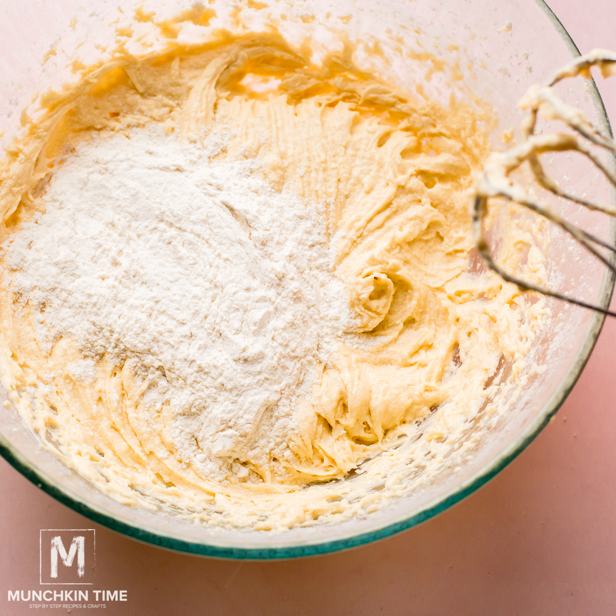 Add flour to the bowl of flour 1 cup at a time.