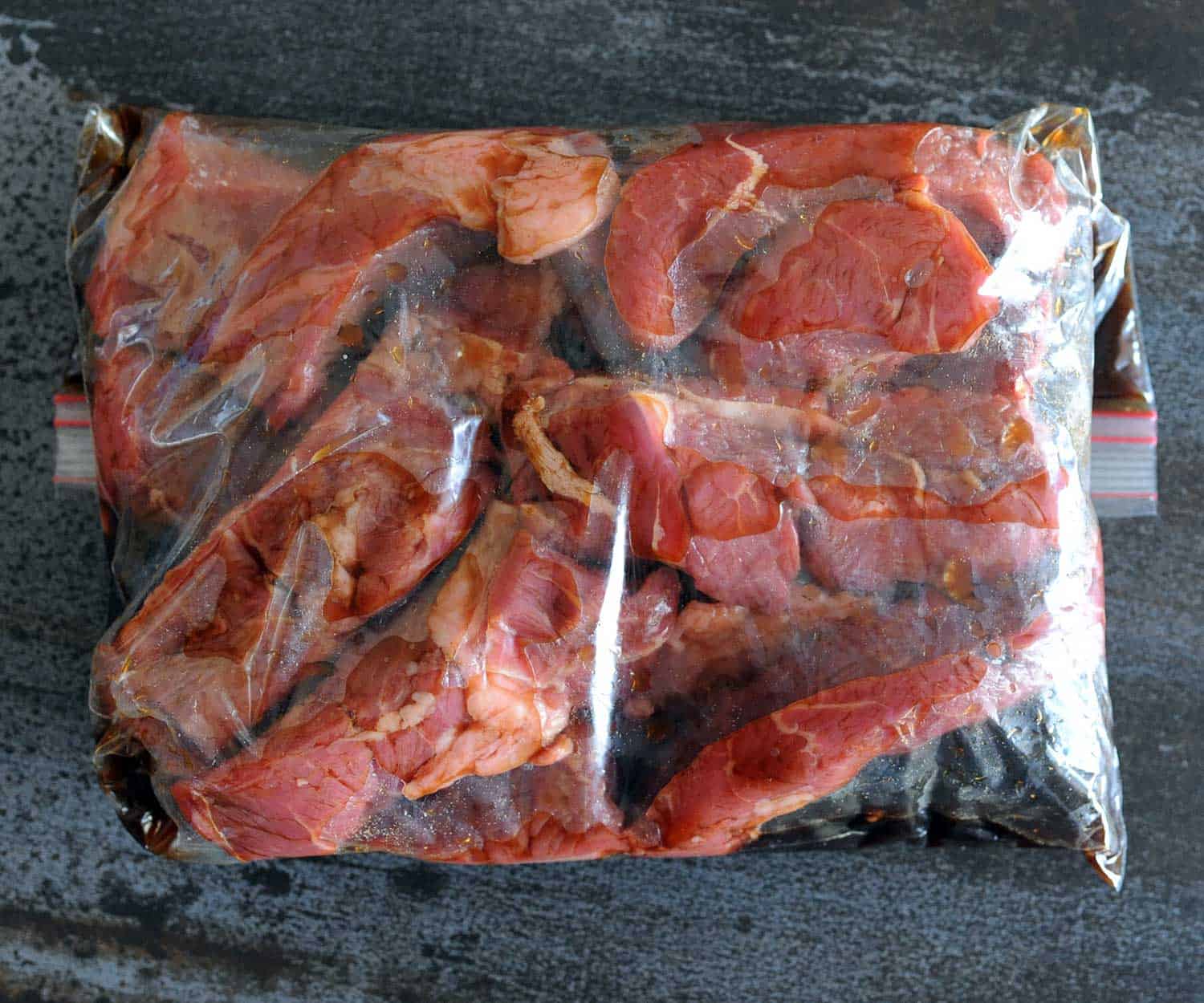 cooked juicy boneless beef tendon lying on foil