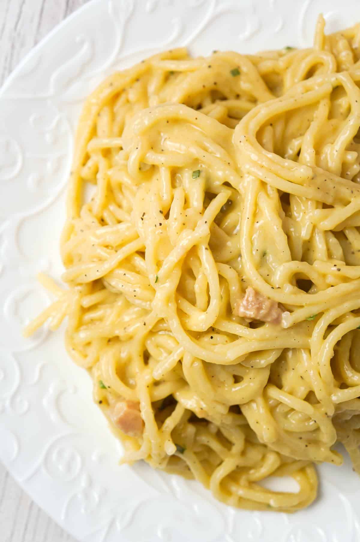 One Pot Chicken Spaghetti is a simple dinner recipe using only spaghetti, thick cream of chicken soup, and seasonings.