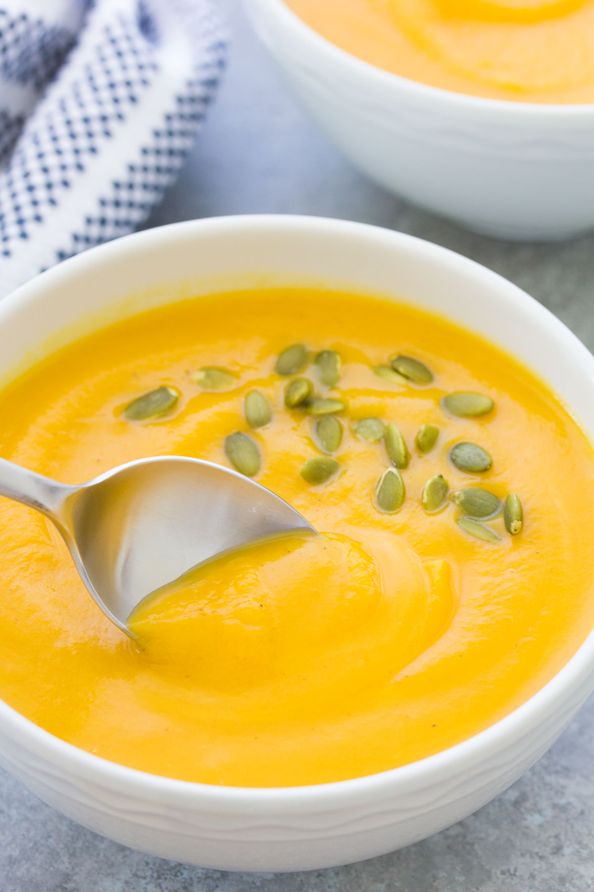 Use a spoon to scoop pumpkin soup in the instant pot