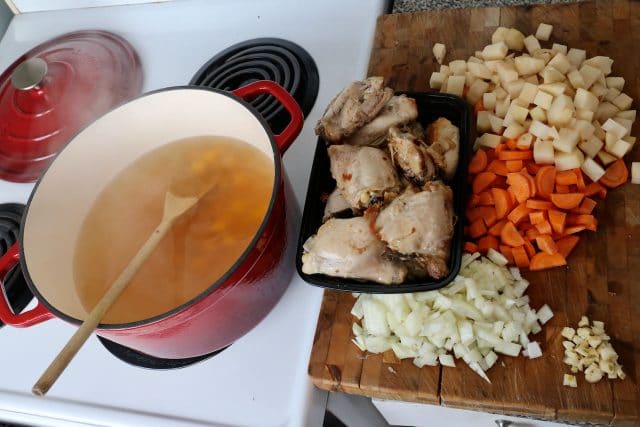 Remove thigh meat from the bone, add to soup, simmer and add salt and pepper to taste.