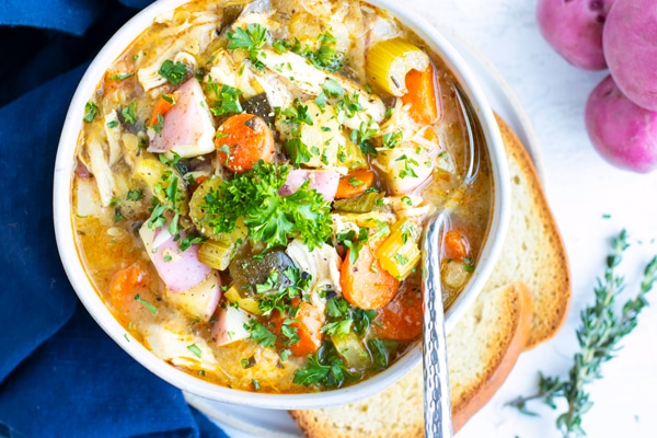 A full bowl of an Instant Pot chicken soup recipe with veggies.