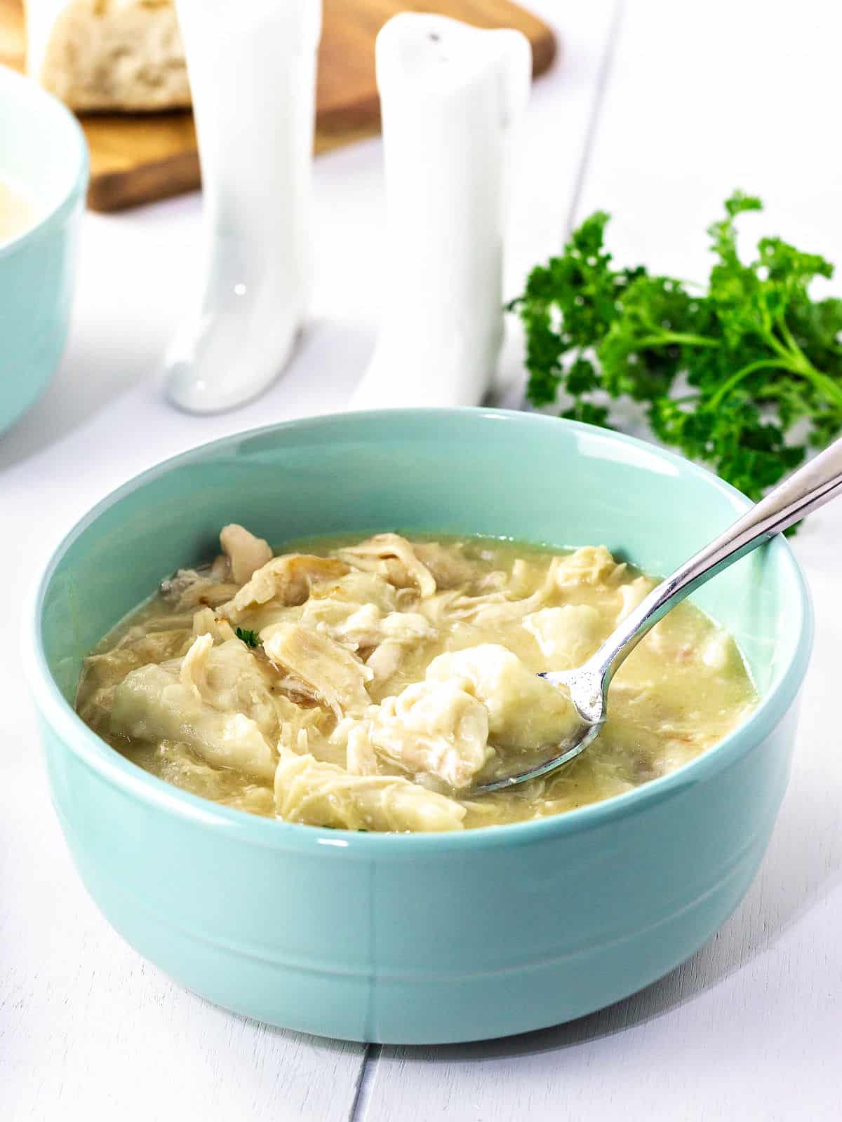 Creamy chicken soup, canned biscuits, chicken breast, black pepper and chicken broth.