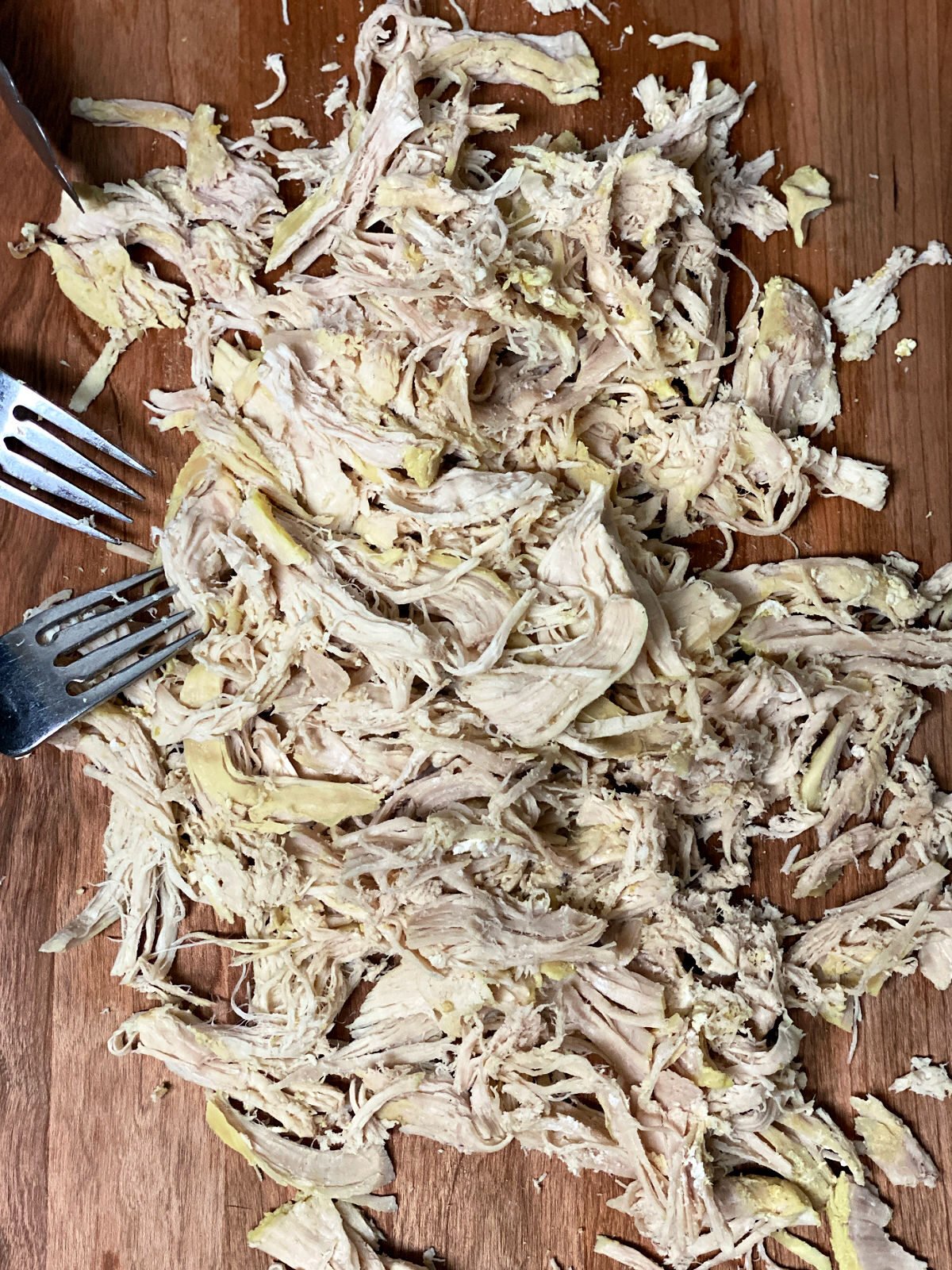 Black spatula stir dumplings in a pressure cooker.