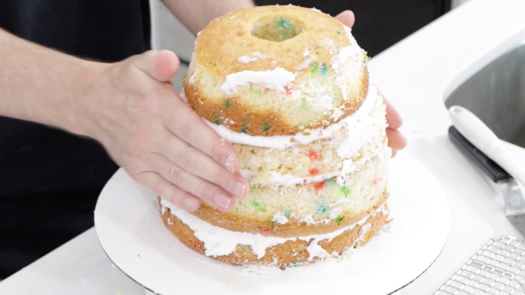 Use your hands to pat the cake and shape it.