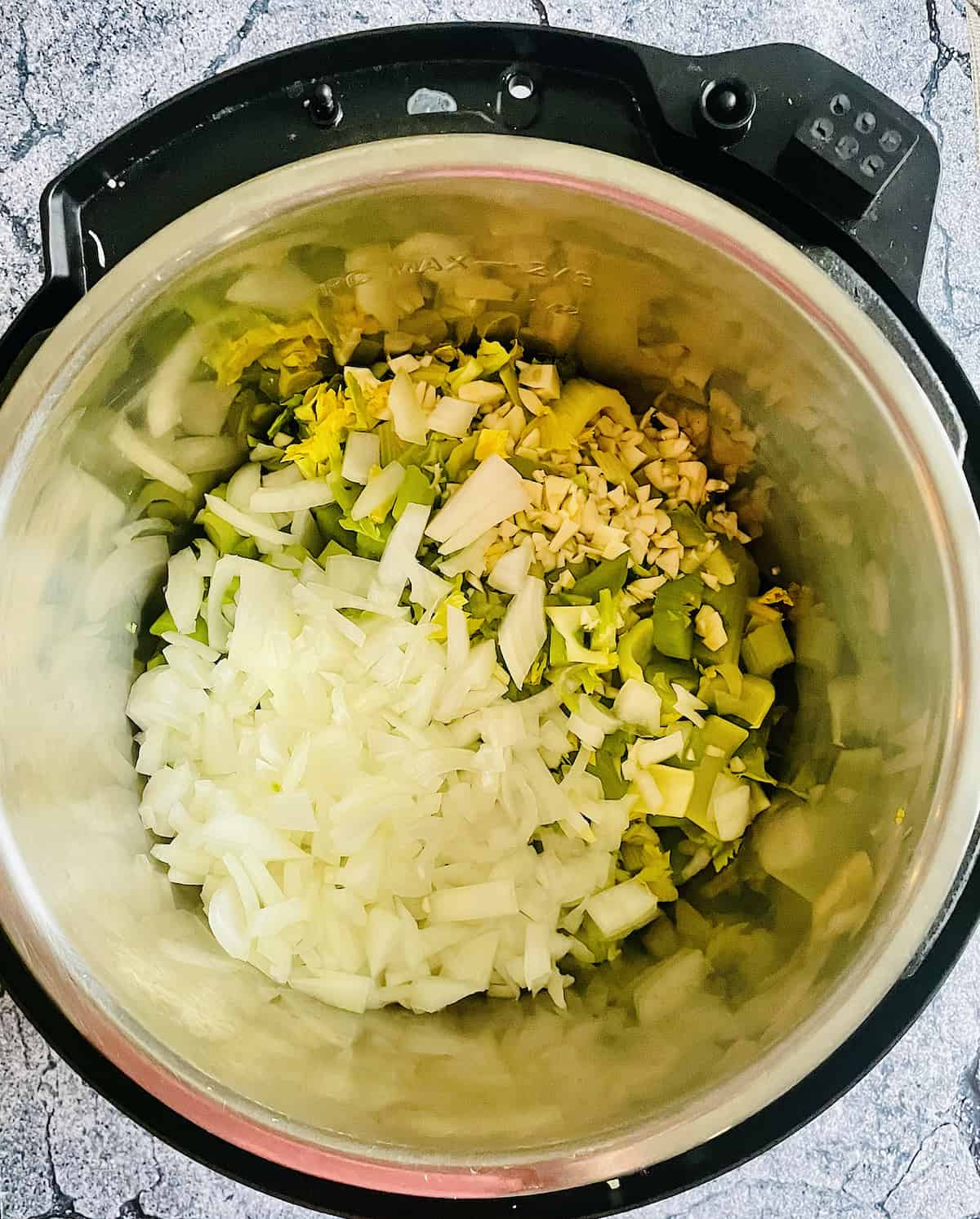 celery, onion, garlic in pressure cooker