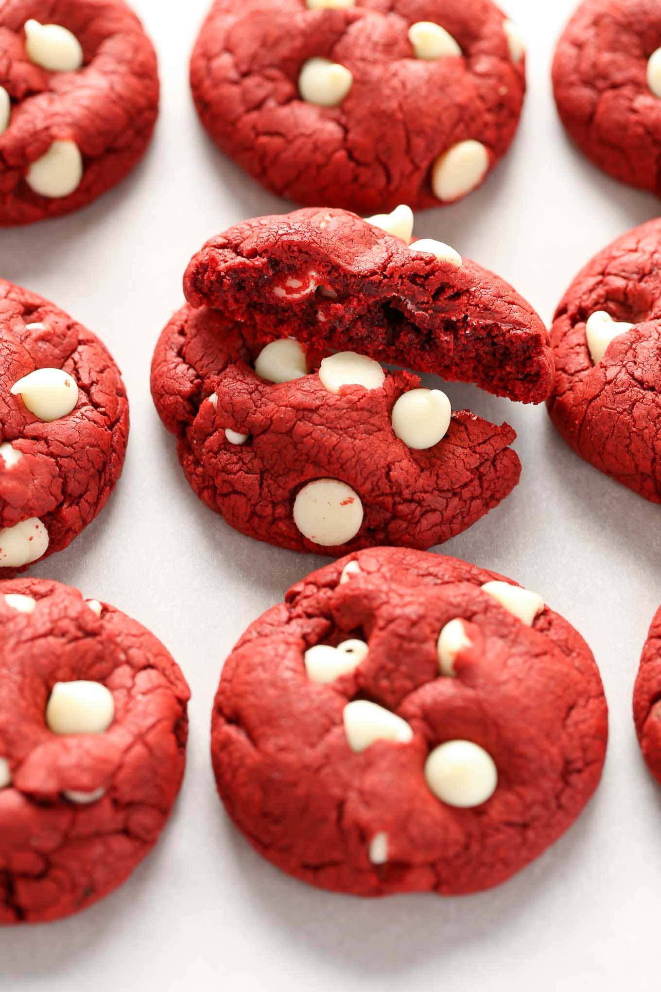 Three rows of biscuits mixed with red velvet cake. The cookie in the middle was broken in half.