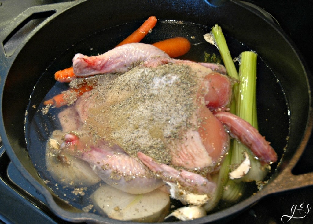 Whole chicken, vegetables, water and seasoning are ready to boil.