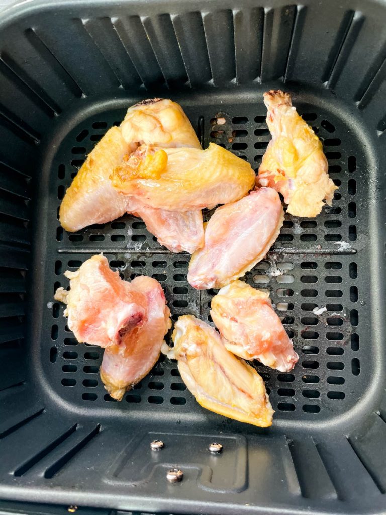 chicken wings air fryer in red and white basket