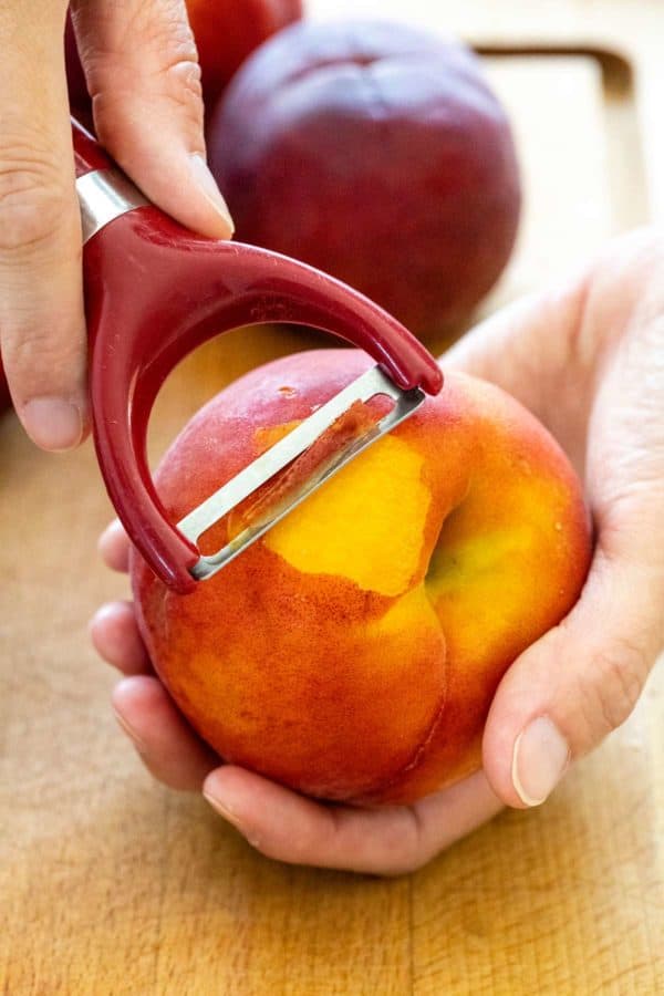 Peel peaches with peeler y