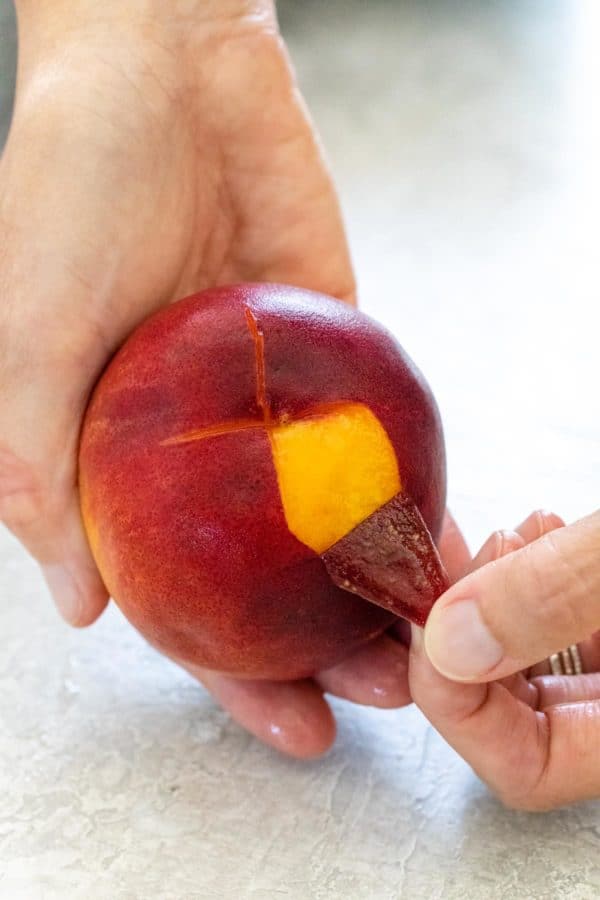 Peel the peaches with your fingers