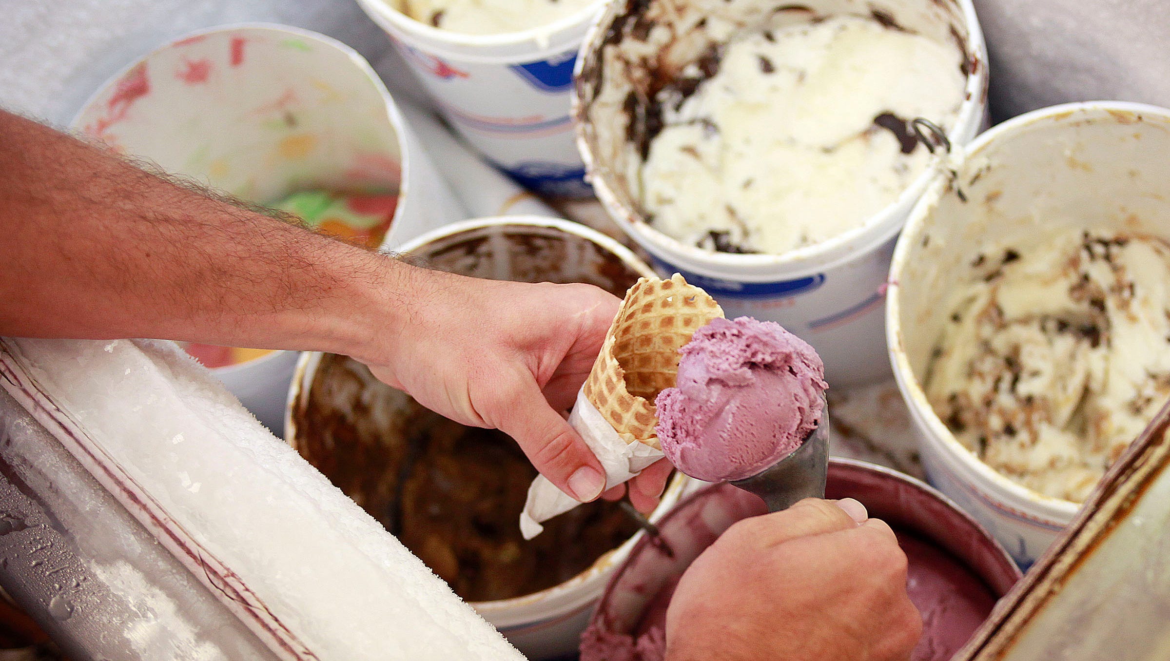 Corey Perrine / Rich Jones staff enjoys raspberry flavored ice cream Thursday, July 12, 2012 in Regina