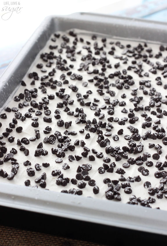 Cannoli Icebox Cake in a 9x13 pan covered with shredded chocolate