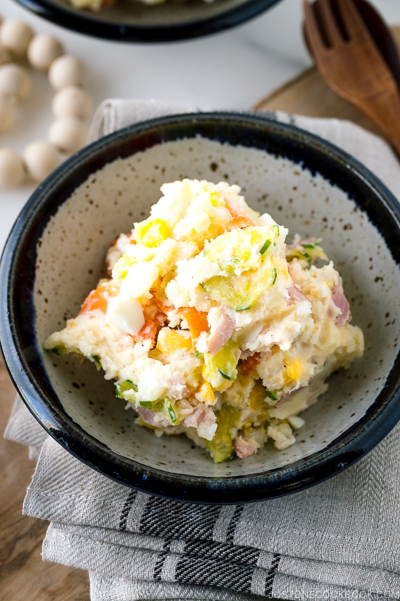 A porcelain bowl of Japanese potato salad.