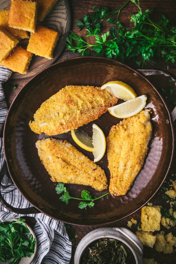 Pan-fried catfish fillet in a cast iron pan