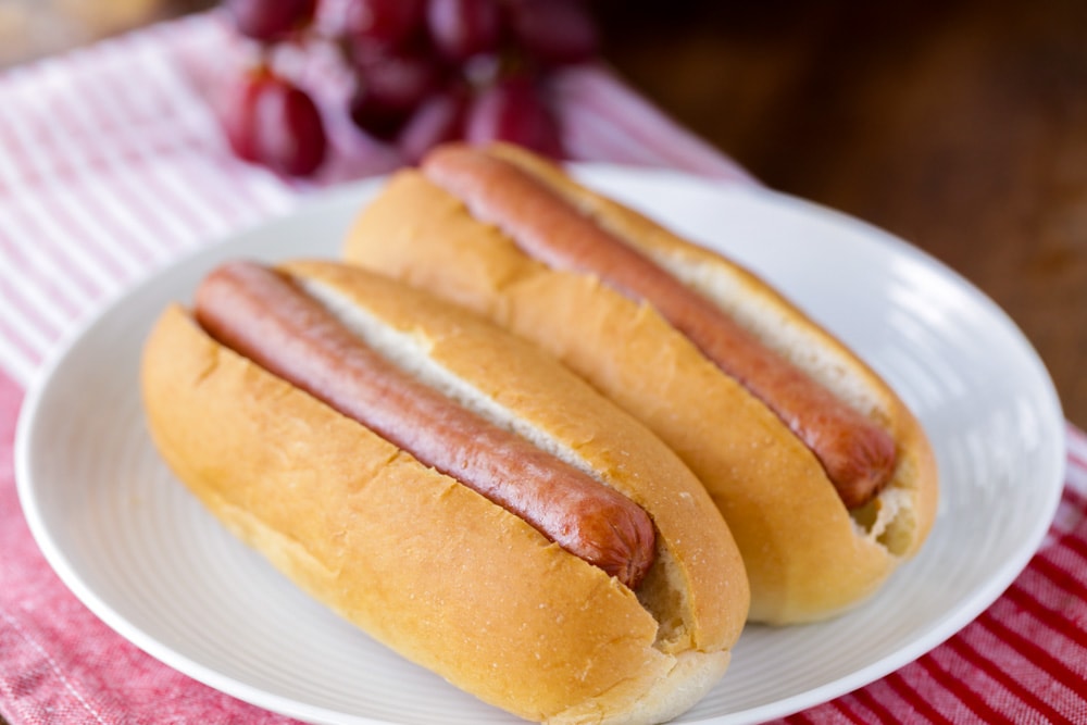 Boil sausages on the stove on the stove