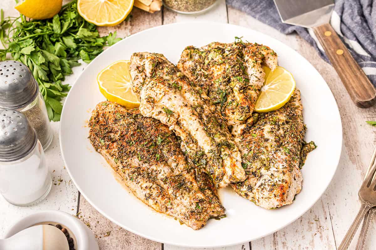 Grill the catfish on a white serving plate.