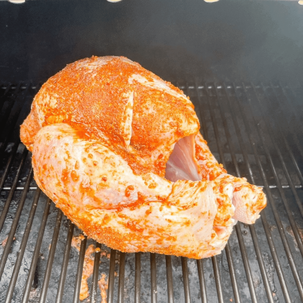 Place seasoned turkey directly on rack of preheated pellet grill