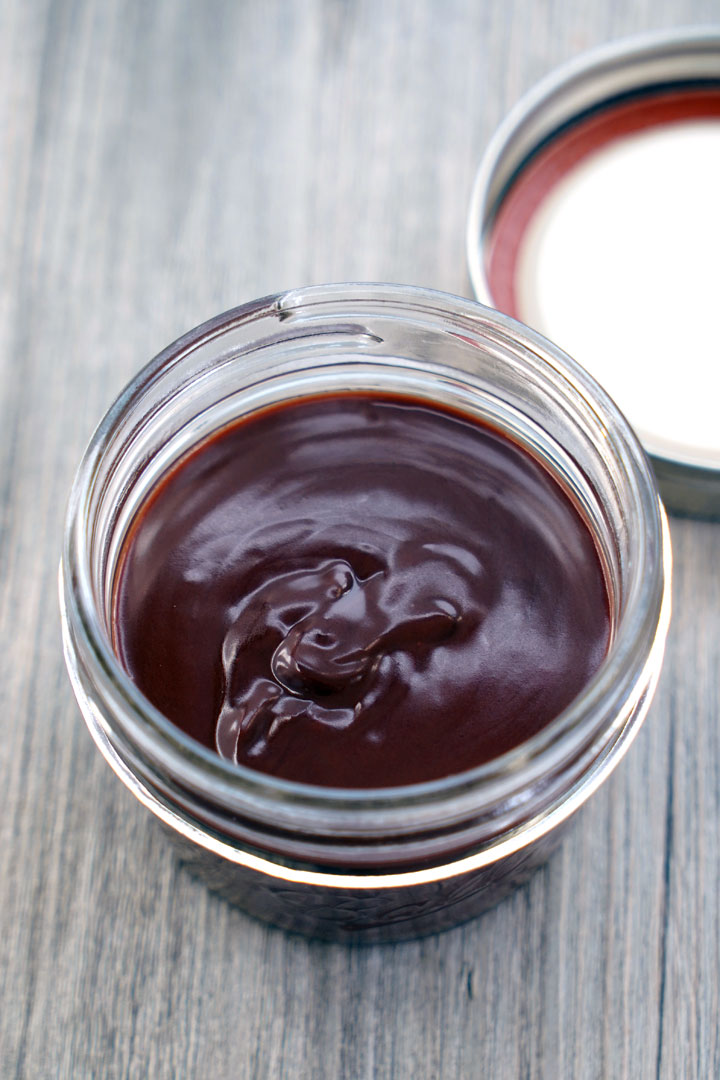 Chocolate sauce in a glass jar.