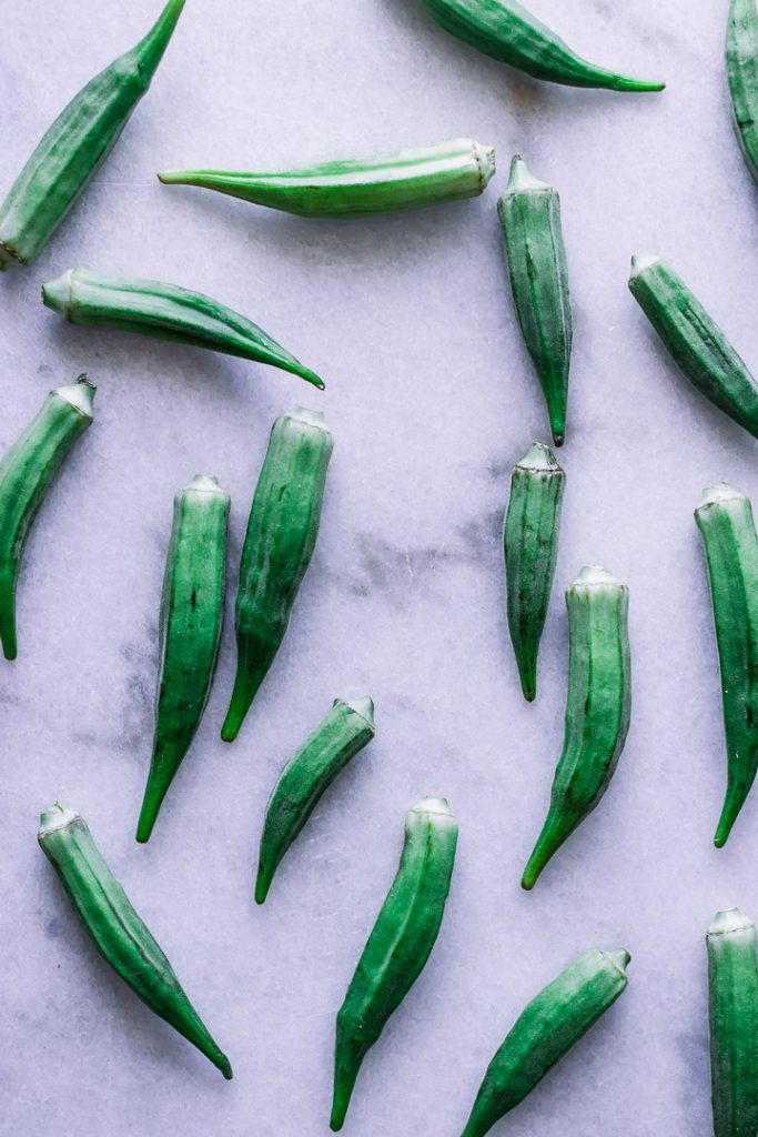 Okra assorted on white marble.