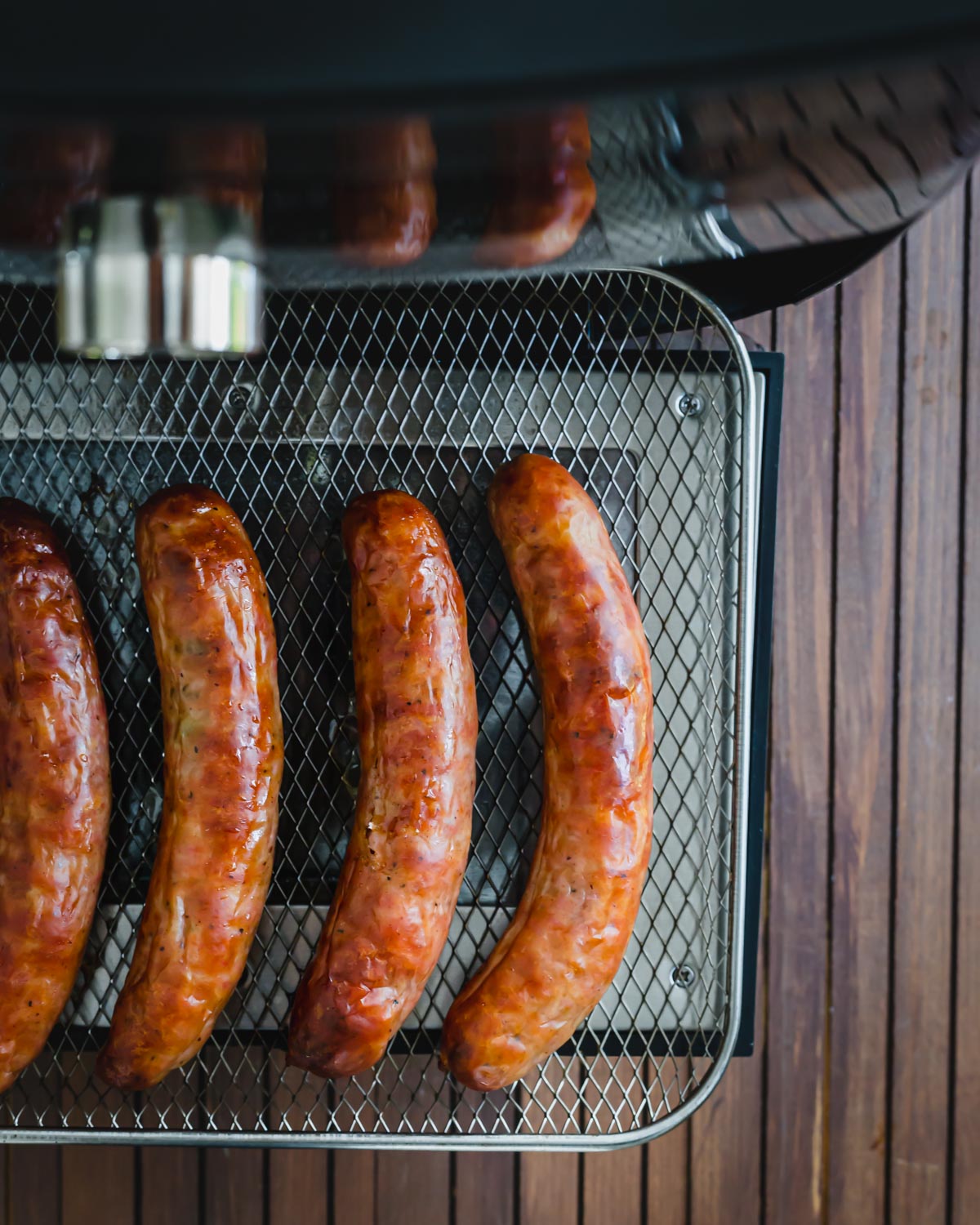 Juicy brats air fryer on tray air fryer.