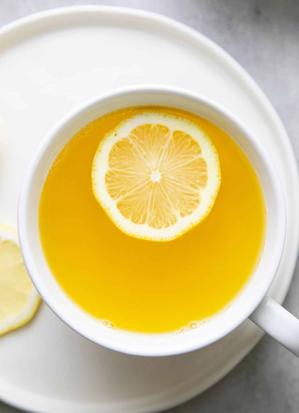 top view detox ginger lemon tea in a cup.