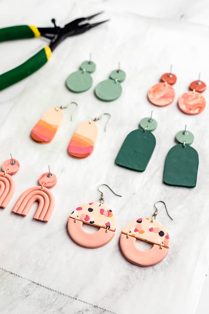 tray of baked polymer clay earrings with posts and hooks