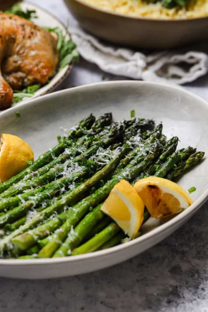 Grilled asparagus with lemon in a bowl