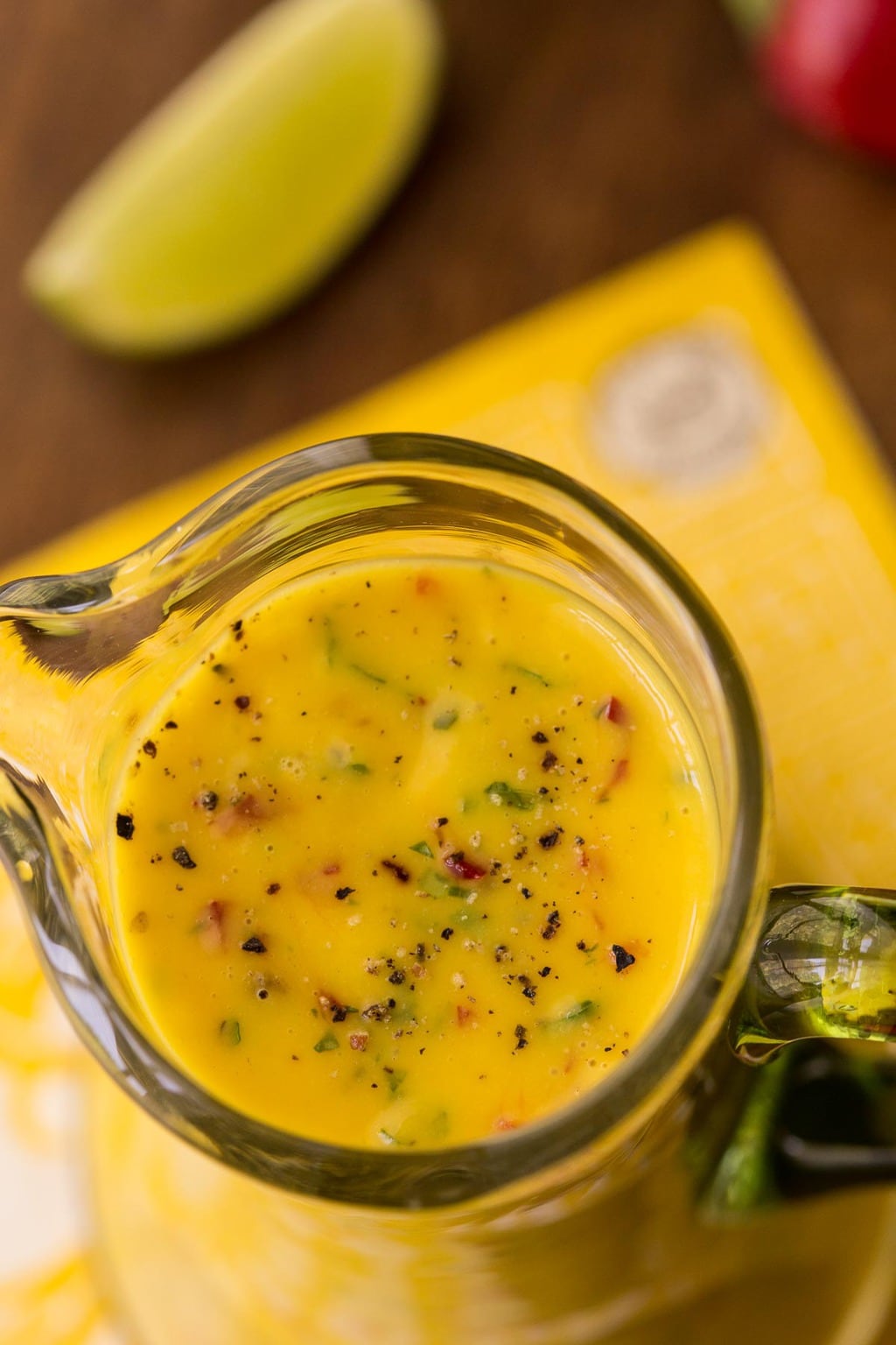 Aerial close-up of a glass carafe with Sweet and Spicy Mango Salad.