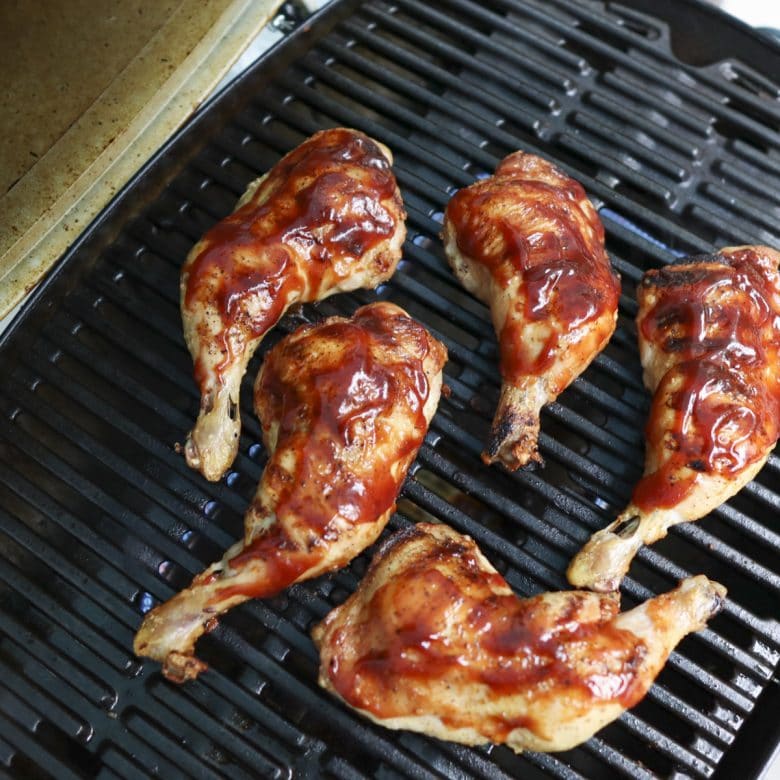 Chicken thighs with bbq sauce on the grill