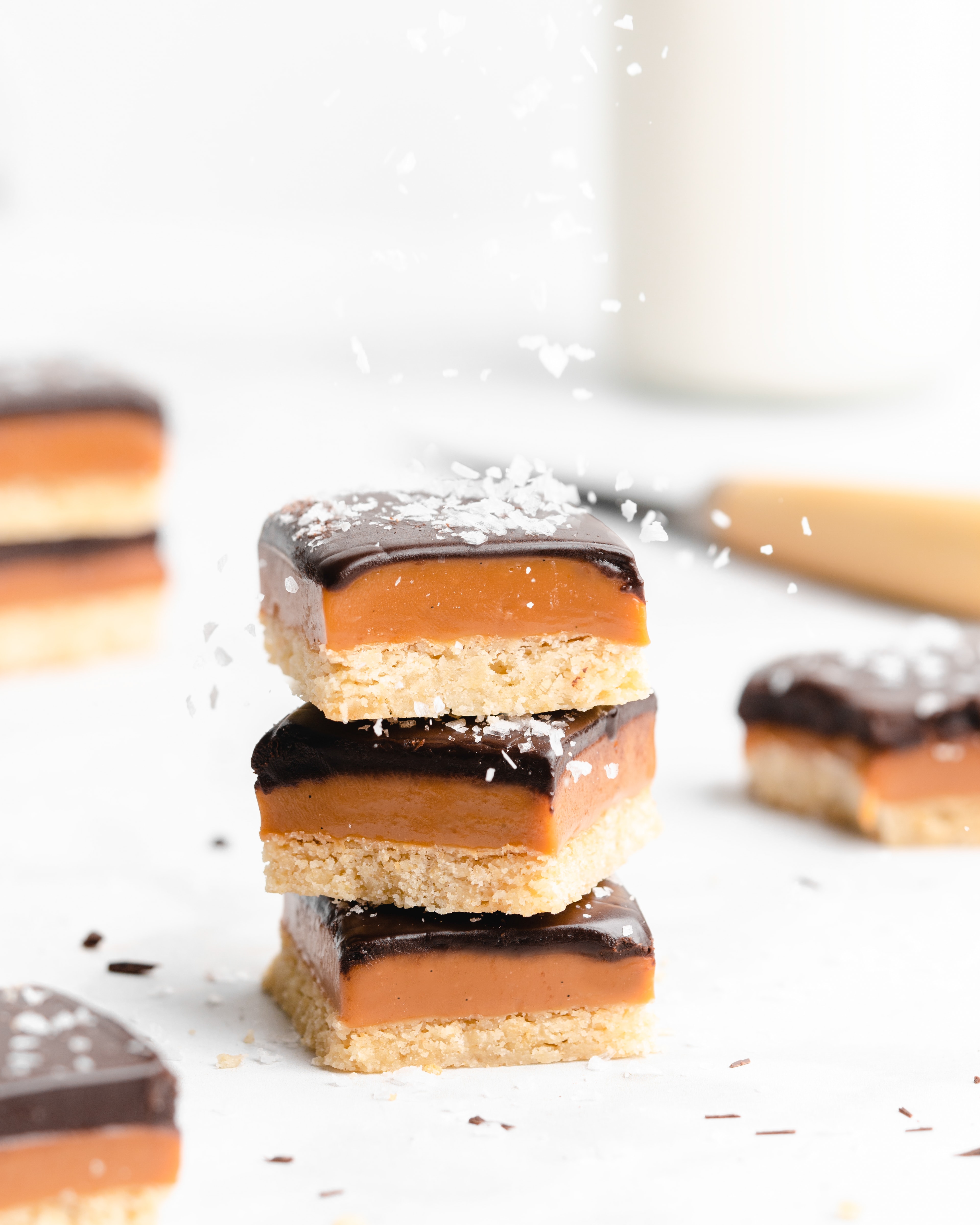 A rich, creamy shortbread covered with a golden caramel cream, topped with vanilla bean bourbon, topped with a layer of dark chocolate and sea salt.