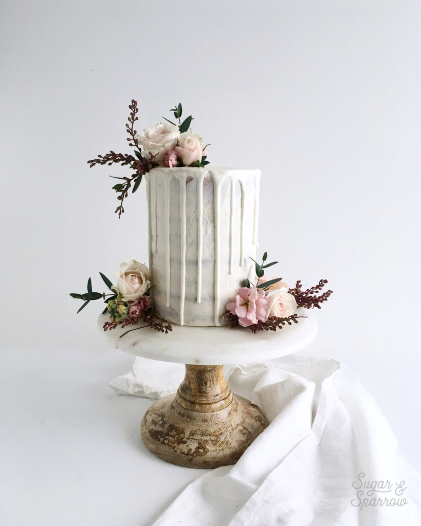 semi-naked drip cake with sugar and sparrow