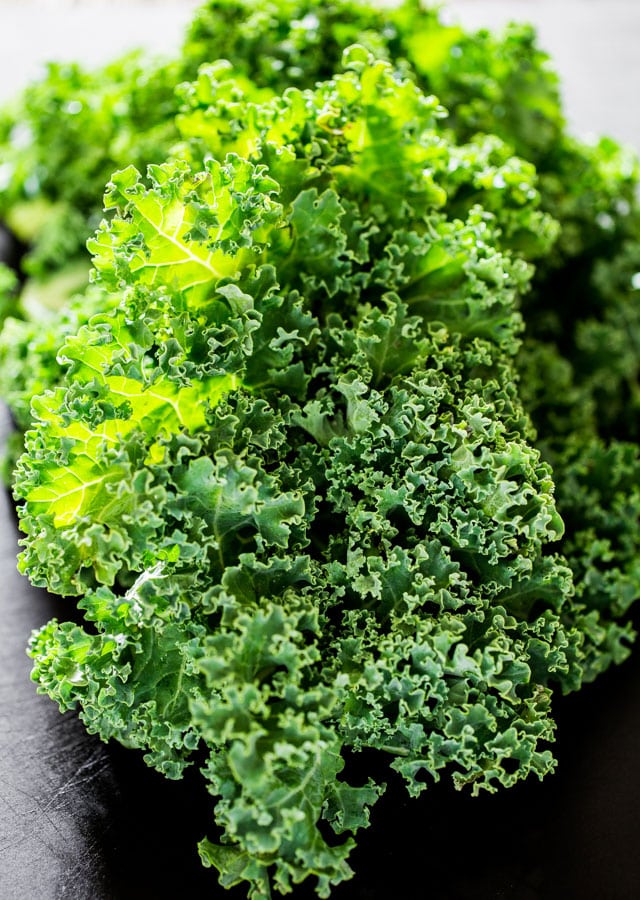 on the cutting board a bunch of kale