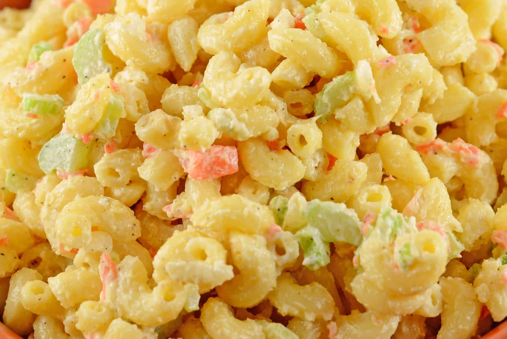 This classic Macaroni salad recipe shows you exactly how to make a pasta salad that will have everyone asking for in seconds. Great for potlucks and cooking! #classicmacaronisalad #howtomakemacaronisalad www.savoryexperiments.com
