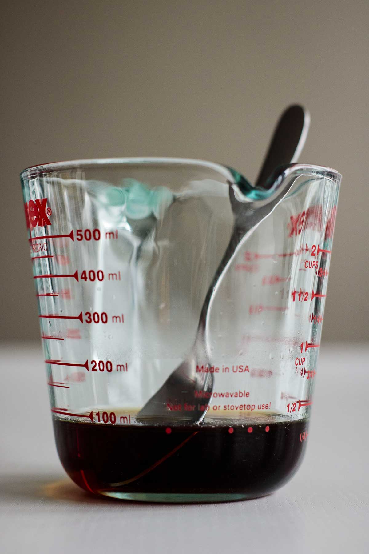 Brown sugar syrup inside the measuring cup.
