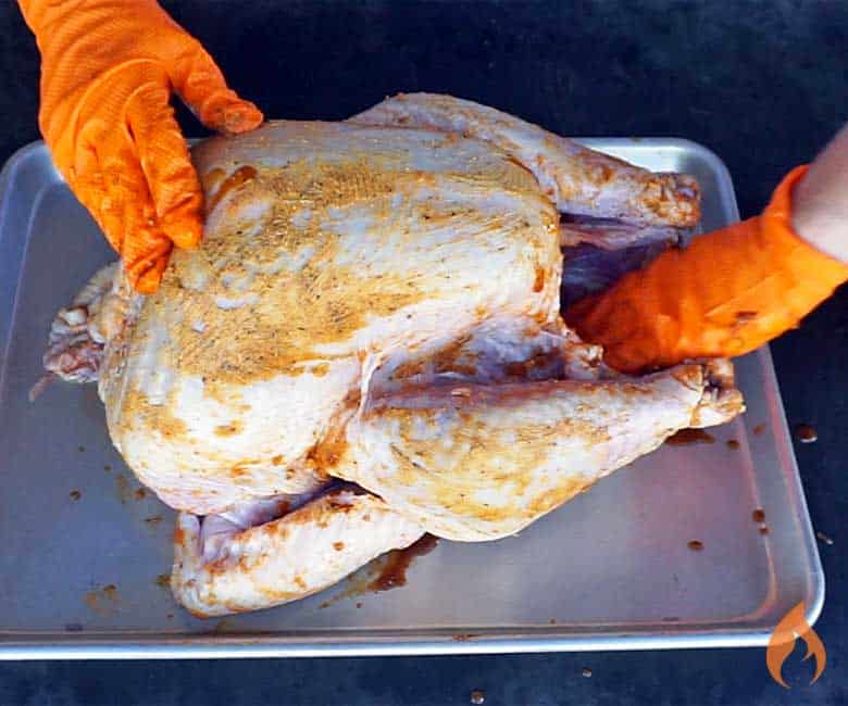 Hand-rubbed raw turkey