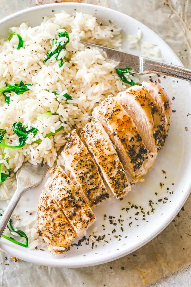 Place chicken breast on a plate and serve with rice.