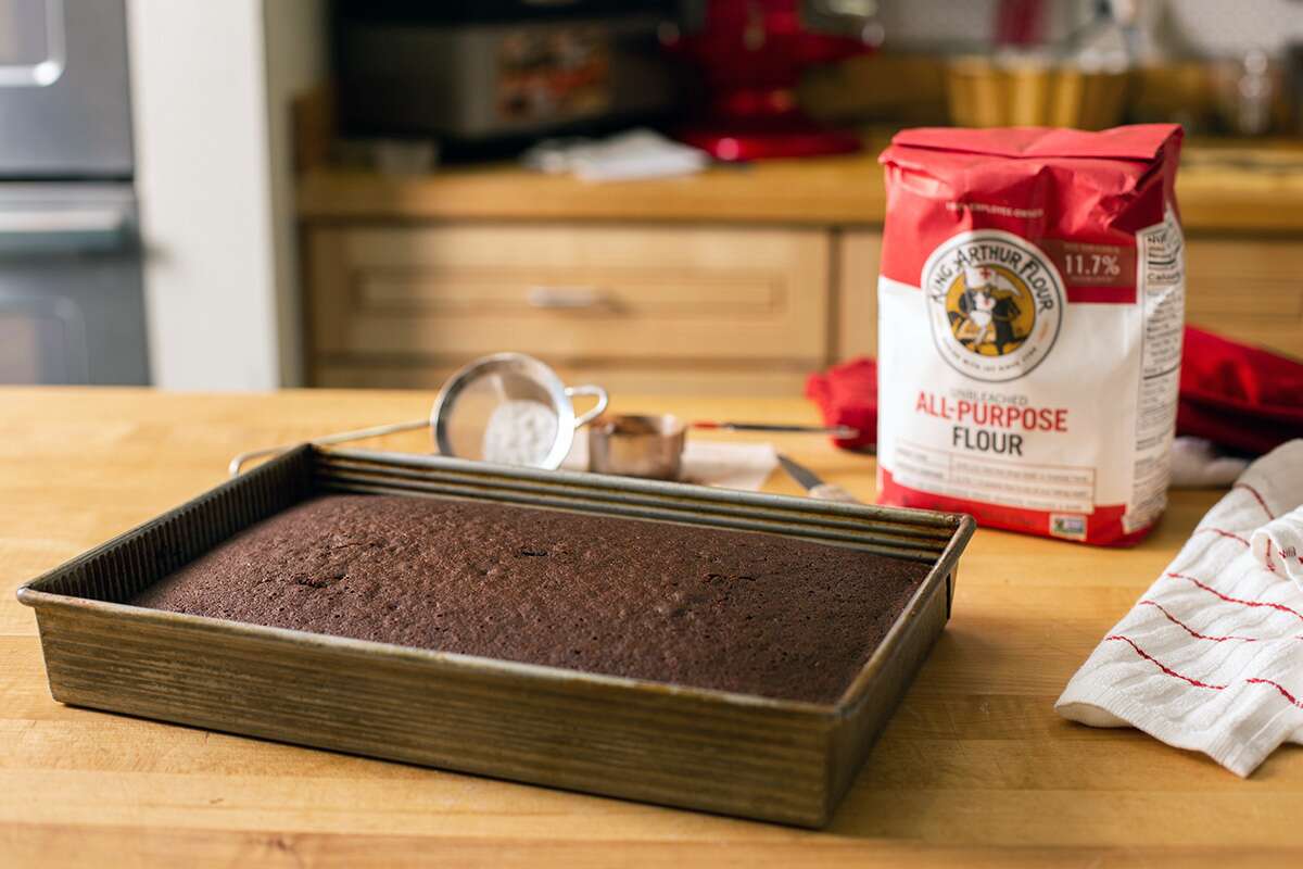 Chocolate cake with a bag of King Arthur Flour, confectionery