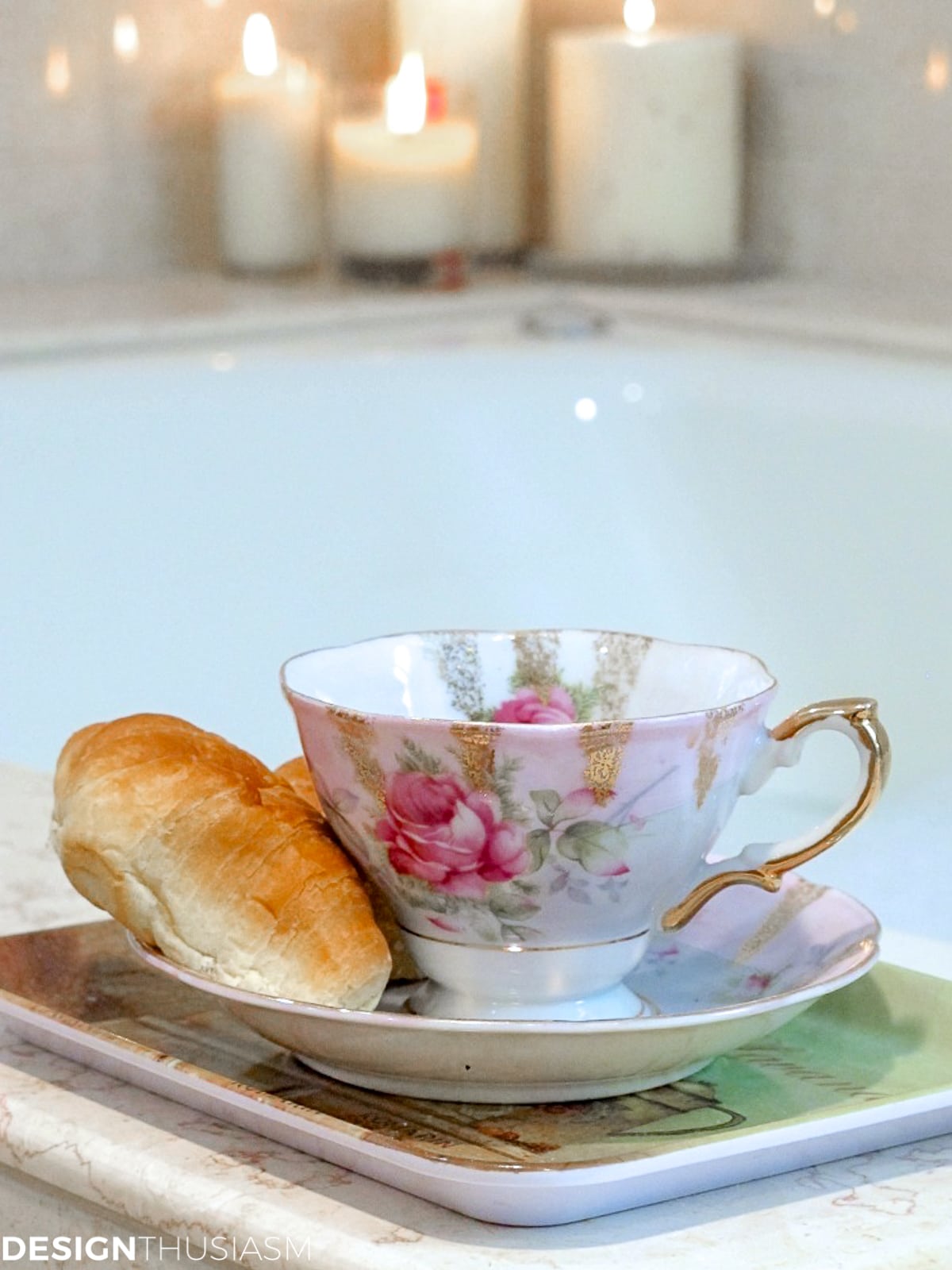 vintage teacups and plates on a tub surround