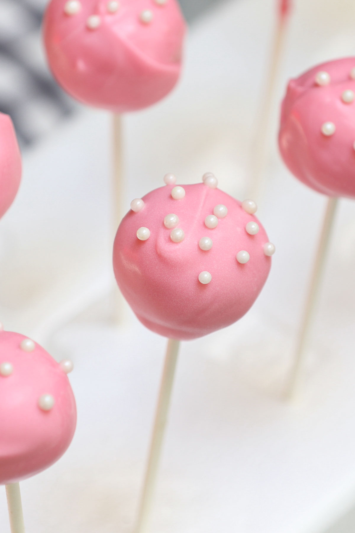 Cake pop is exactly what they sound like - a cross between cake and lollipops! These pink gifts are perfect for birthday parties. Although made very popular by coffee shop chains, these Starbucks Cake Pops can easily be recreated at home.