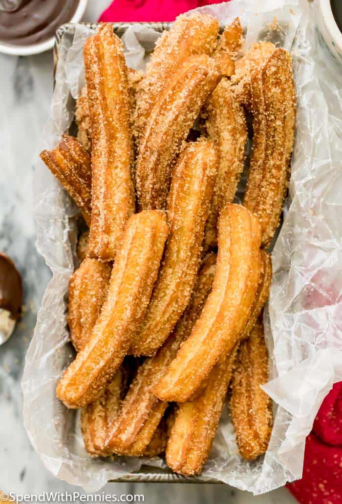 Churros in a pan with parchment